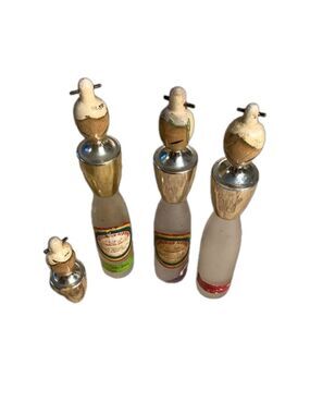 3 decorative Japanese liquor bottles depicting women